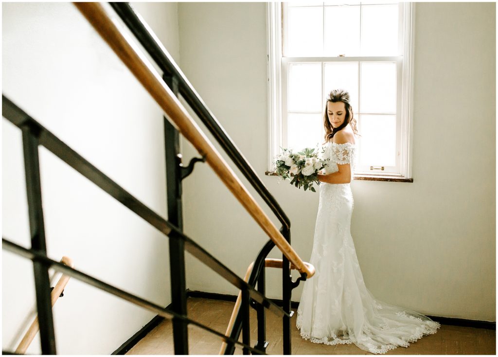 bride posing in stairway
